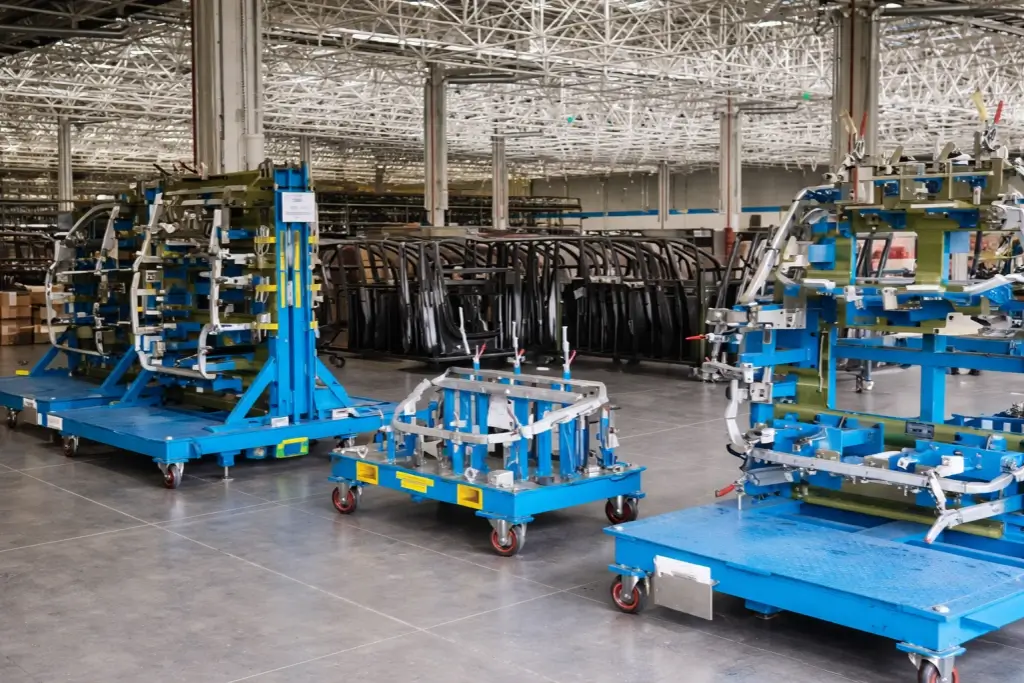 blue color car assembly line trolley in a factory plant