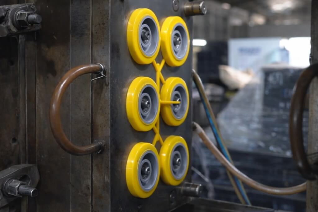 6 injected yellow wheels in an injection mold