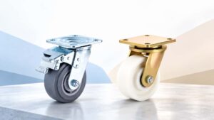 Two industrial swivel casters with contrasting gray and white wheel treads.